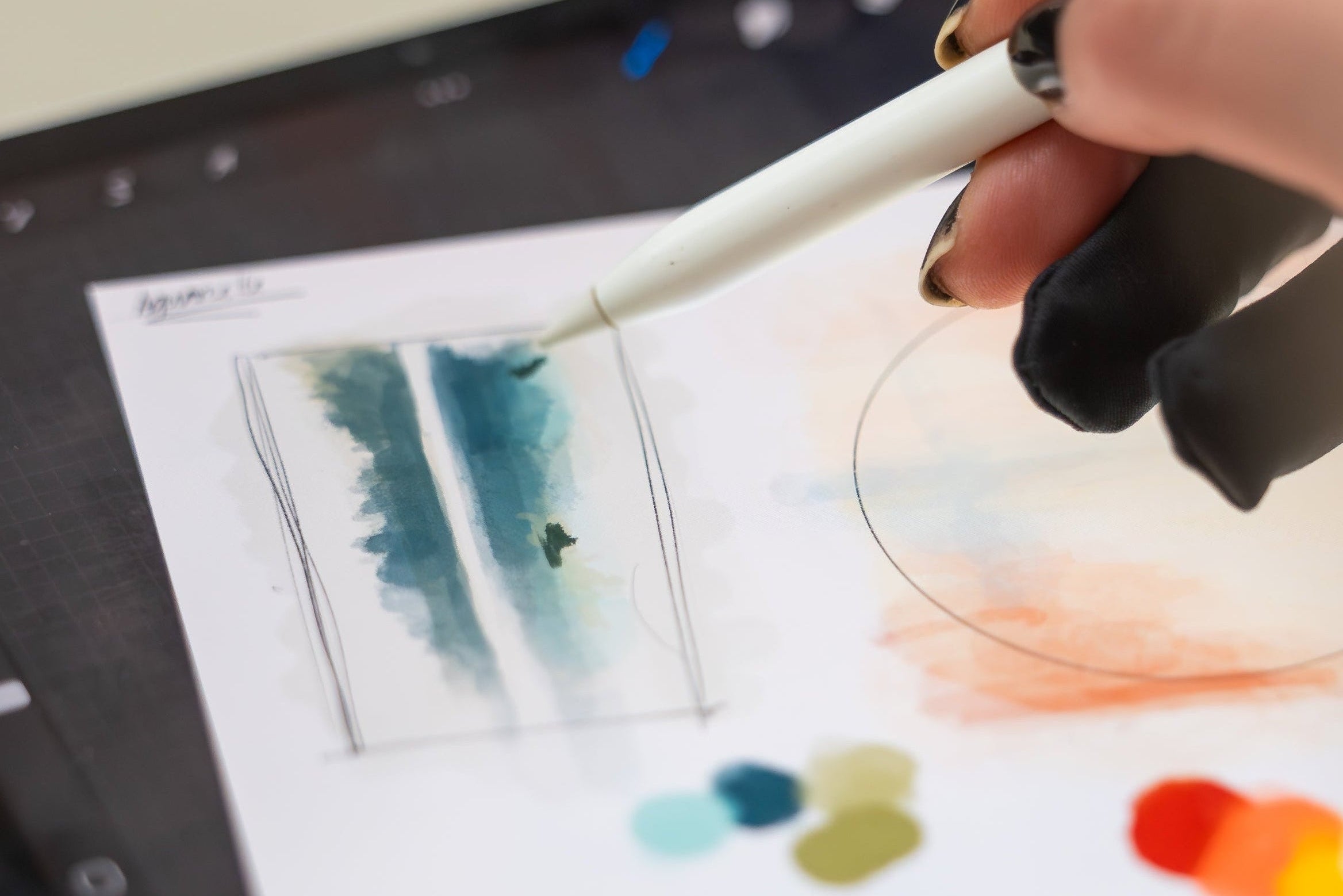 Person using a stylus on a digital art tablet with a color palette displayed.